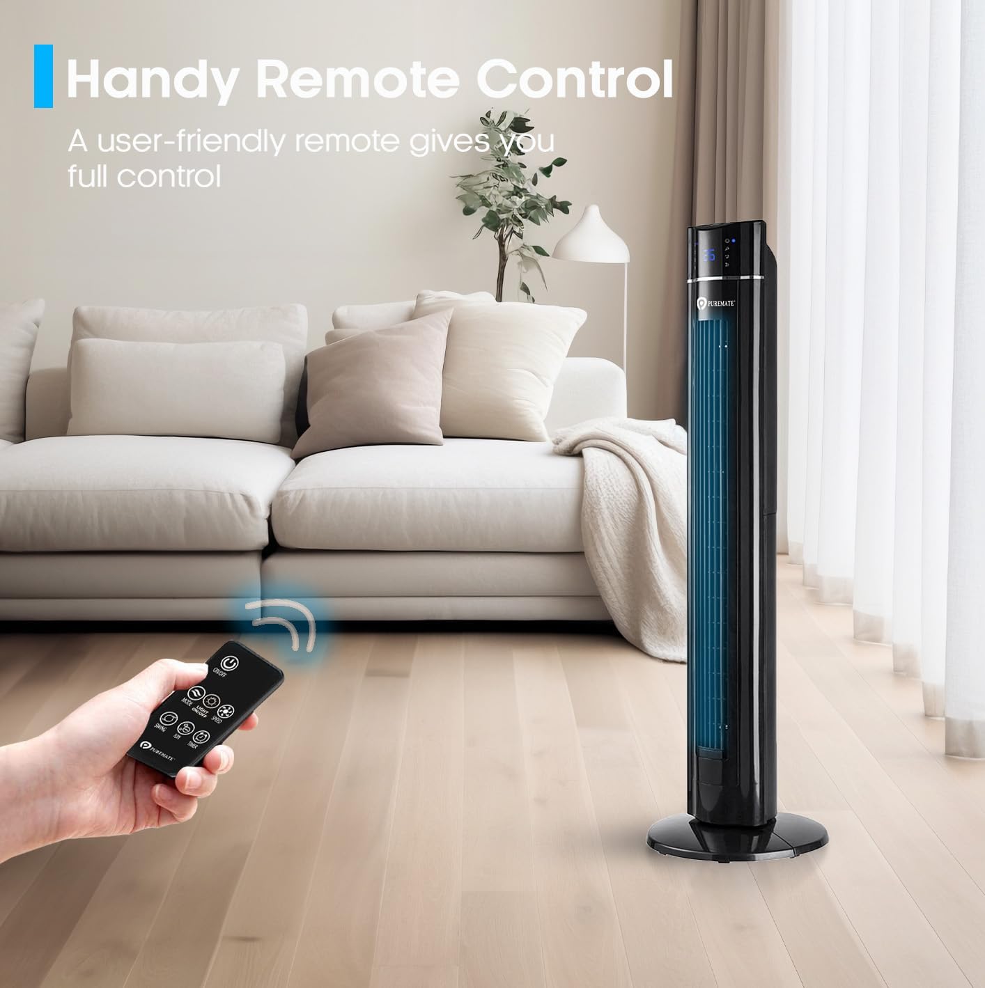 Hand holding remote control pointing at PureMate Tower Fan