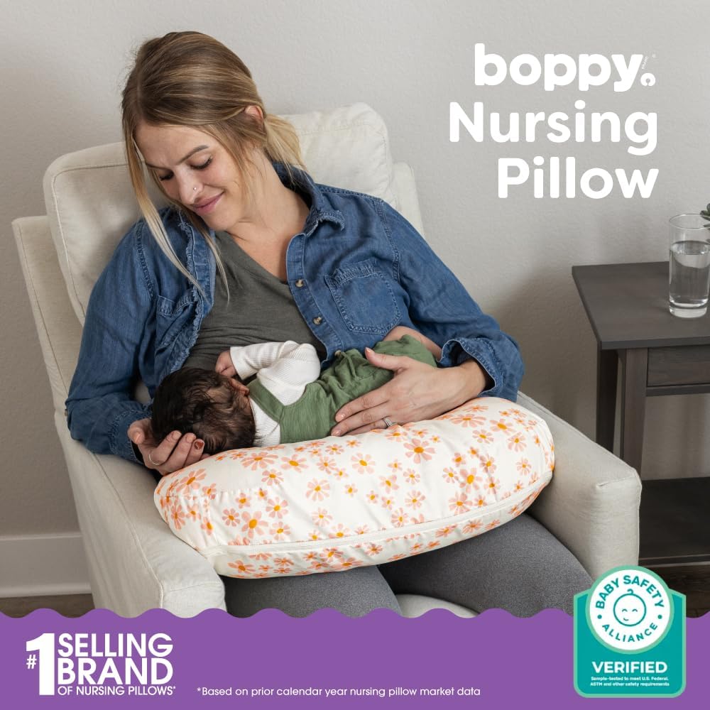 Boppy Nursing Pillow - Firm, Ergonomic U-Shaped Bottle and Breastfeeding Pillow with High Lift for Comfort and Support, Spacious Surface - Soft Pink Daisies
