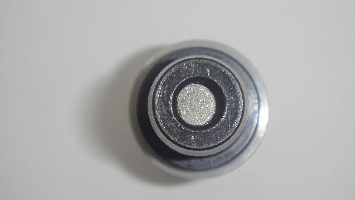 Tmiem view of the PCV Valve 18118-78G50, showing the opening of the other port.