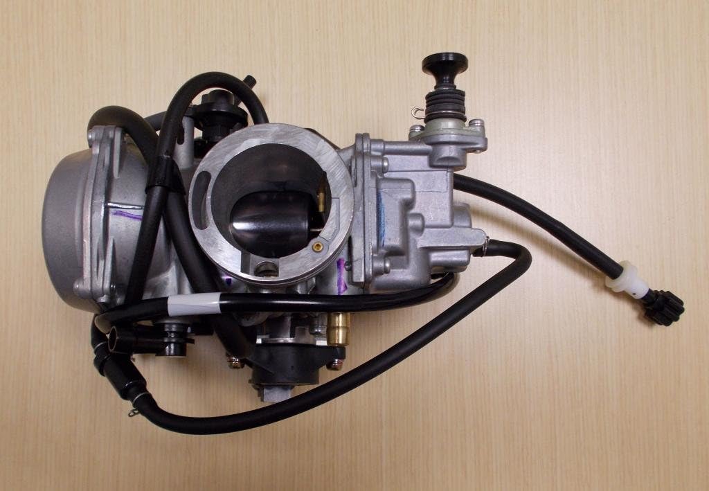 Top-down view of the Honda TRX 650 Rincon carburetor, showing the air intake and throttle body.