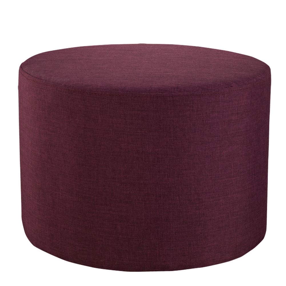 Petit pouf ottoman rembourré violet pour soulager les jambes lourdes après le travail