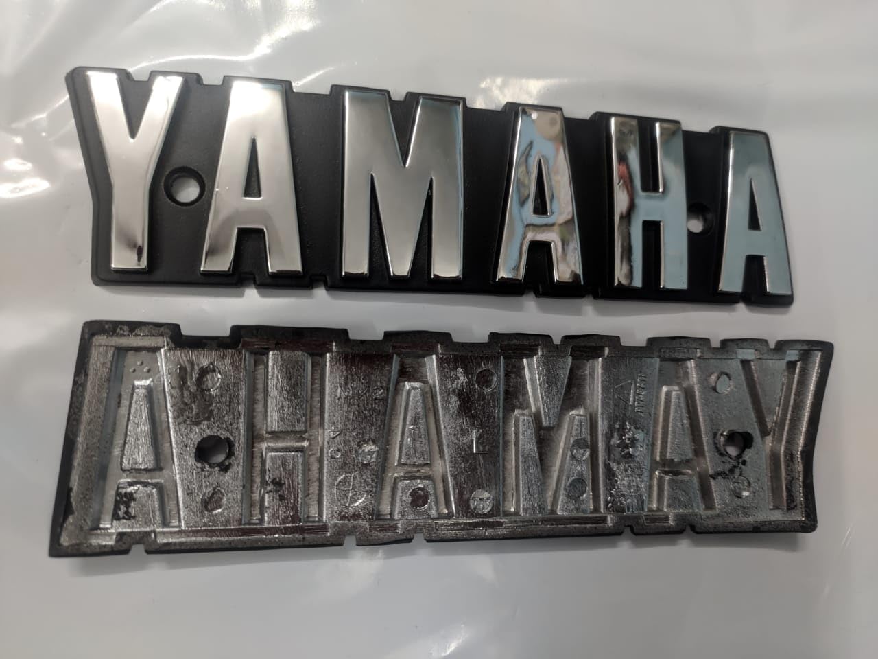 Shopping Stall ™ Tank Sticker RX 100 Tank Monogram Original Silver Back Side OEM Tank Logo RX 135 RX100, RXG, Original Petrol Tank Sticker Logo Emblem RX 100