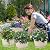 Quarut 10 inch Plastic Flower Pots for Indoor Plants?4 Pack Large Outdoor Planter Pot with Drainage Holes & Saucers?Imitation Wine Barrel Design?for Indoor Outdoor Garden Plants?Beige?