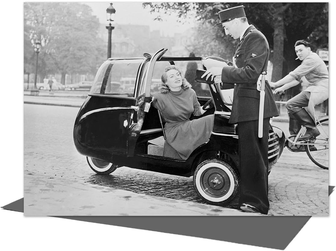 Holy Mackerel Lady in bubble car vintage photographic card featuring an image of the Microbo three wheeler, 1953-12.6 x 17.7cm and blank inside