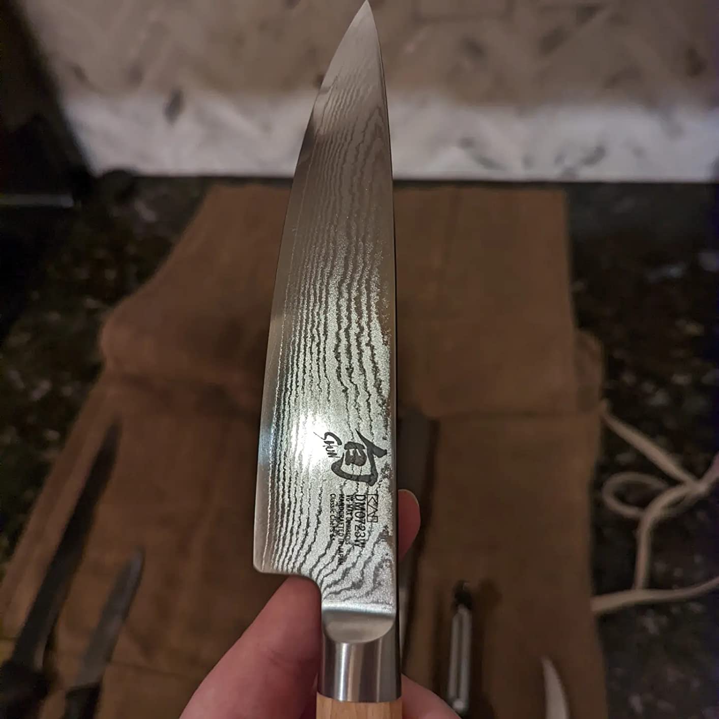 Close-up of the Shun Classic blade showing the Damascus pattern