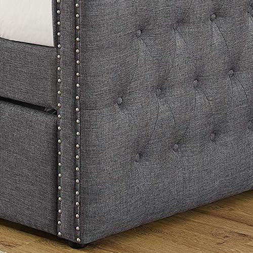 Close-up of tufted upholstery and nailhead trim on the daybed