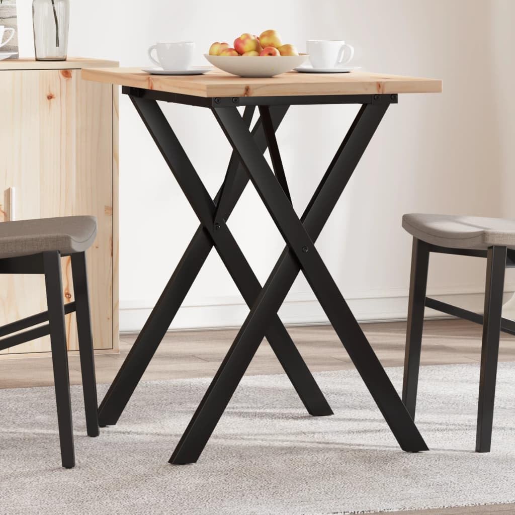 Table à manger avec structure en X en pin pour un coin repas chaleureux dans un studio urbain