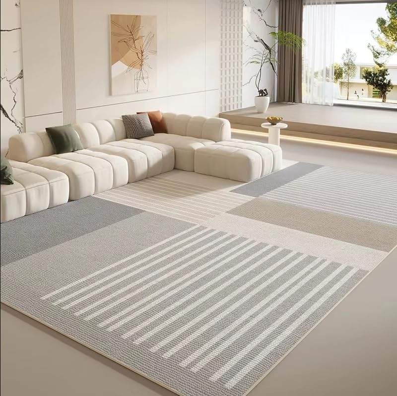 Tapis de style nordique au pied du canapé pour un salon cosy