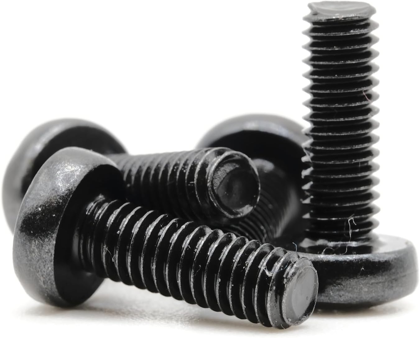 Group of black screws, close-up, different angle