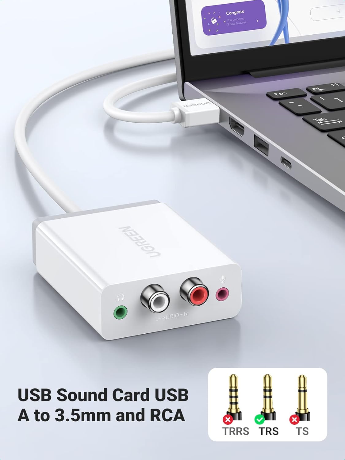UGREEN USB External Stereo Sound Card connected to a laptop