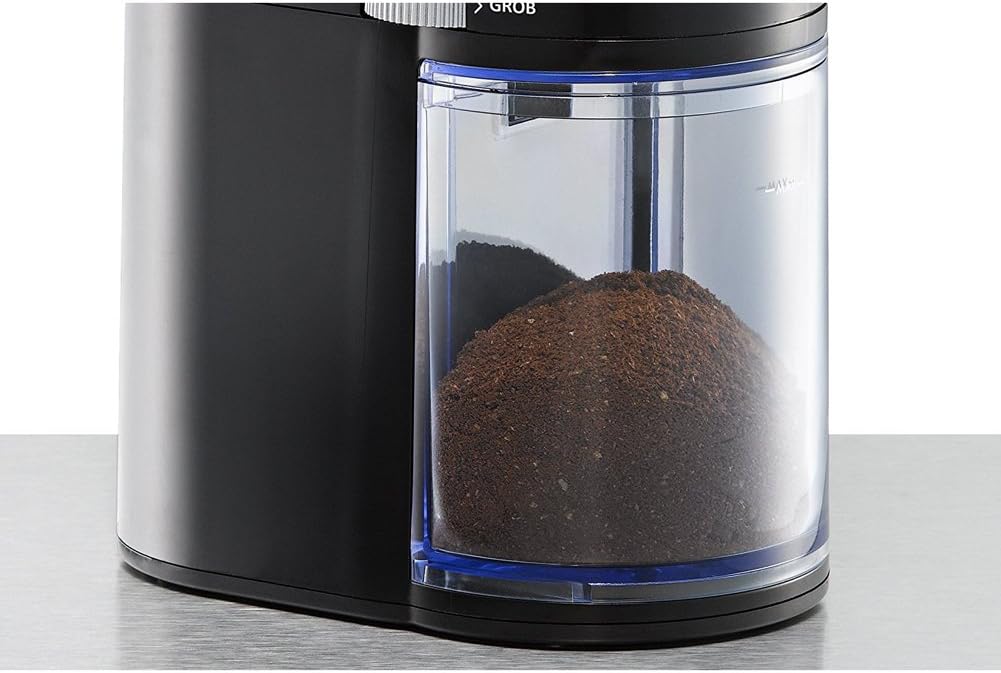 Close-up of ground coffee in the powder collector of the EKM200 grinder