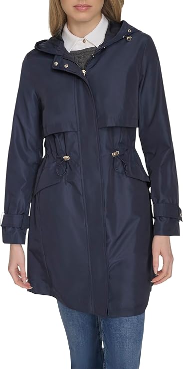 Detail shot of the jacket collar, fabric texture, and zipper