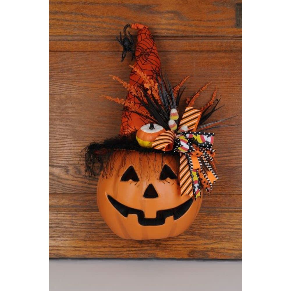 Calabaza iluminada con maíz y caramelo para decorar la puerta