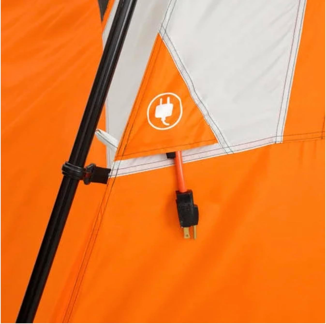 Close-up of the E-port on the tent wall, showing an electrical cord passing through a zippered opening.