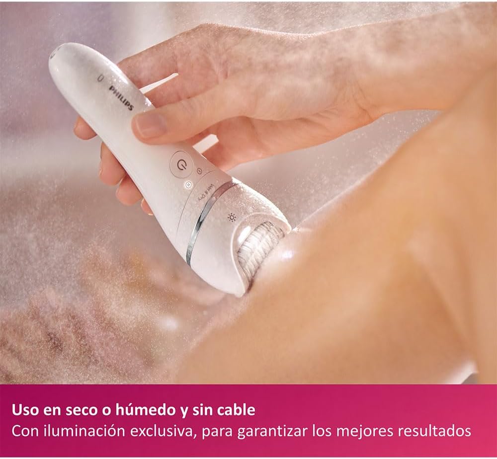 Woman using Philips epilator on leg in a wet environment