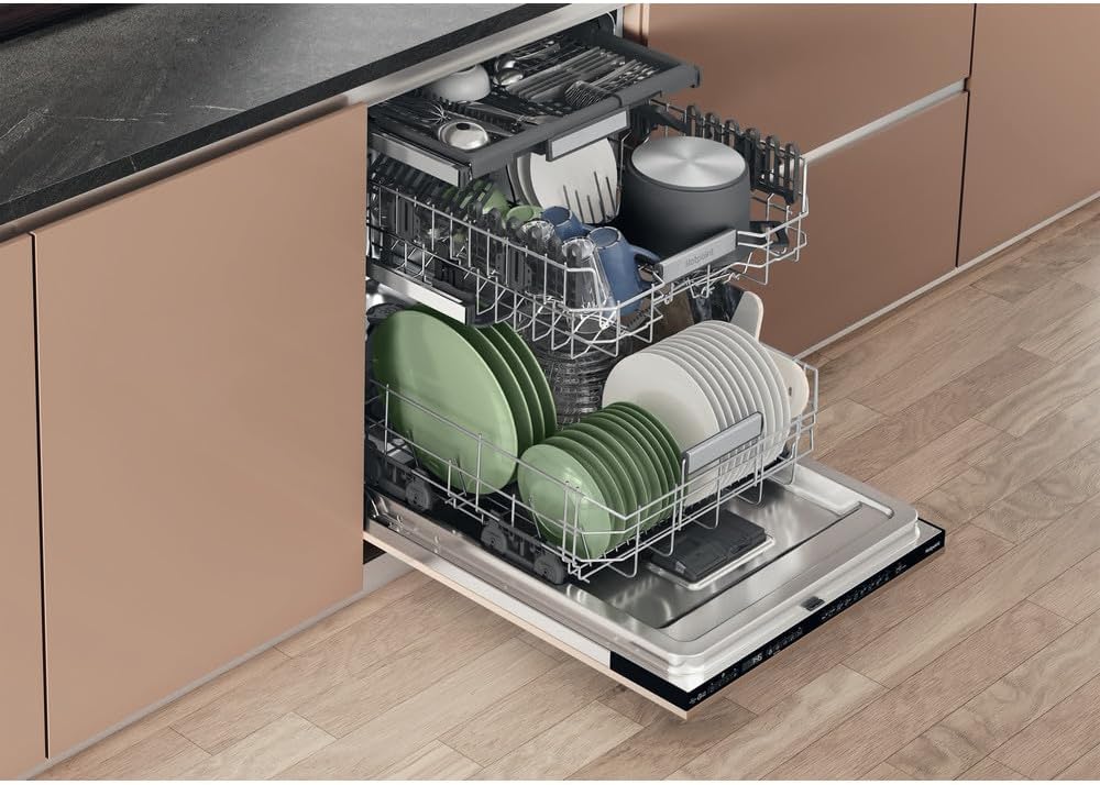 Interior view of Hotpoint H7IHP42LUK dishwasher loaded with dishes