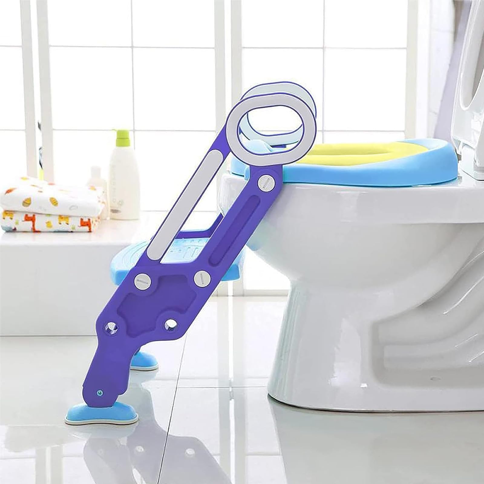 Aufun Sedile WC per bambini con scala regolabile, sedile per WC pieghevole con cuscino in poliuretano, adatto per WC da 38 a 42 cm, per bambini da 1 a 7 anni, colore: blu/lilla