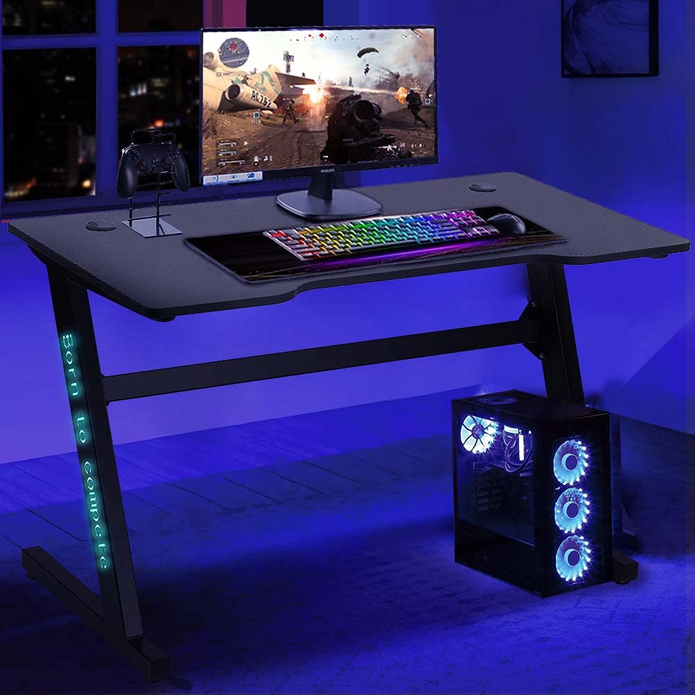 BAKAJI Bureau Gaming Porte-PC avec lumières LED RGB Changement de Couleur Structure Métal Plateau Bois Texture Fibre de Carbone avec Tapis Souris Mousepad Inclus 120 x 60 x 73 cm Jeu Online