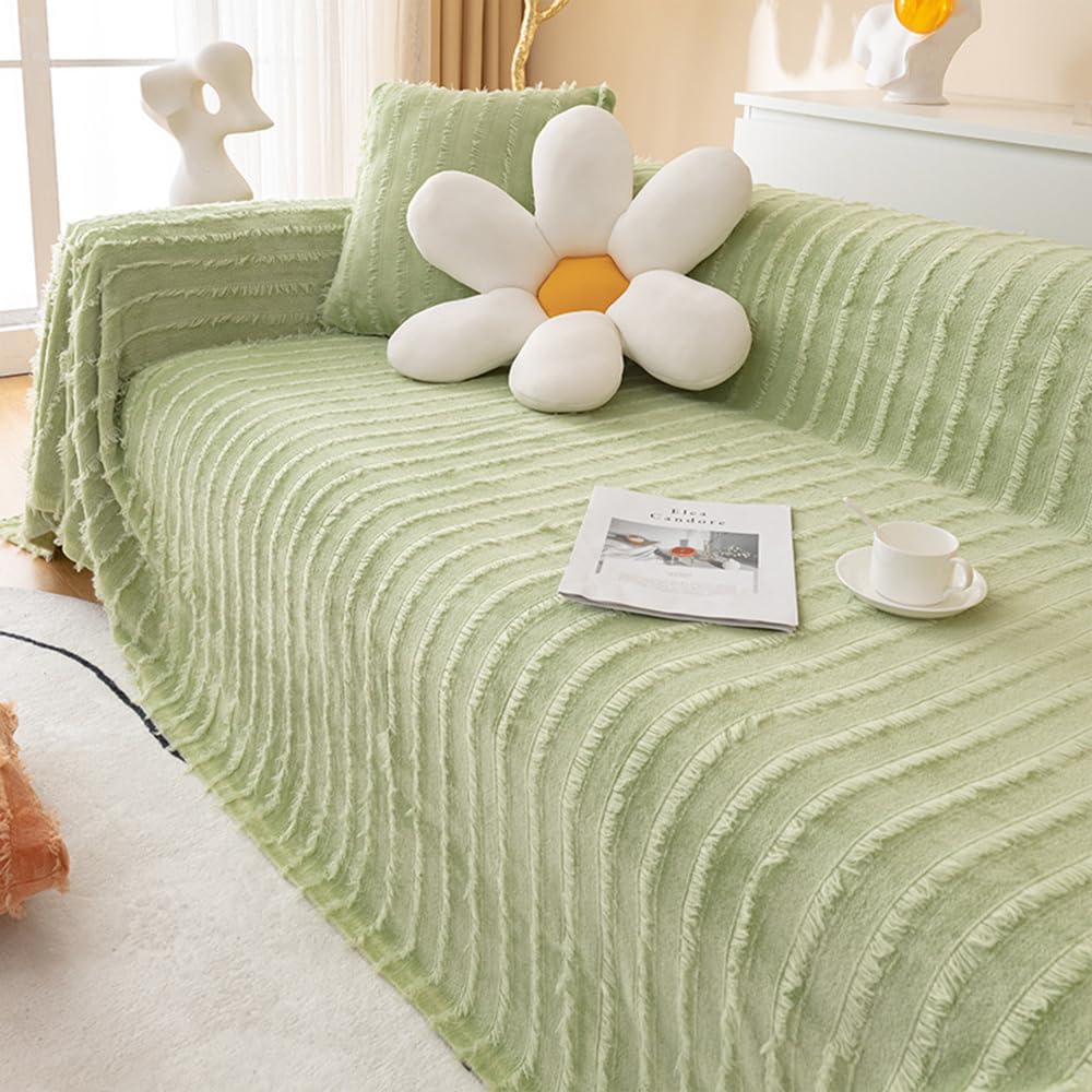 Jeté de canapé à pompons pour réchauffer vos soirées cocooning au salon