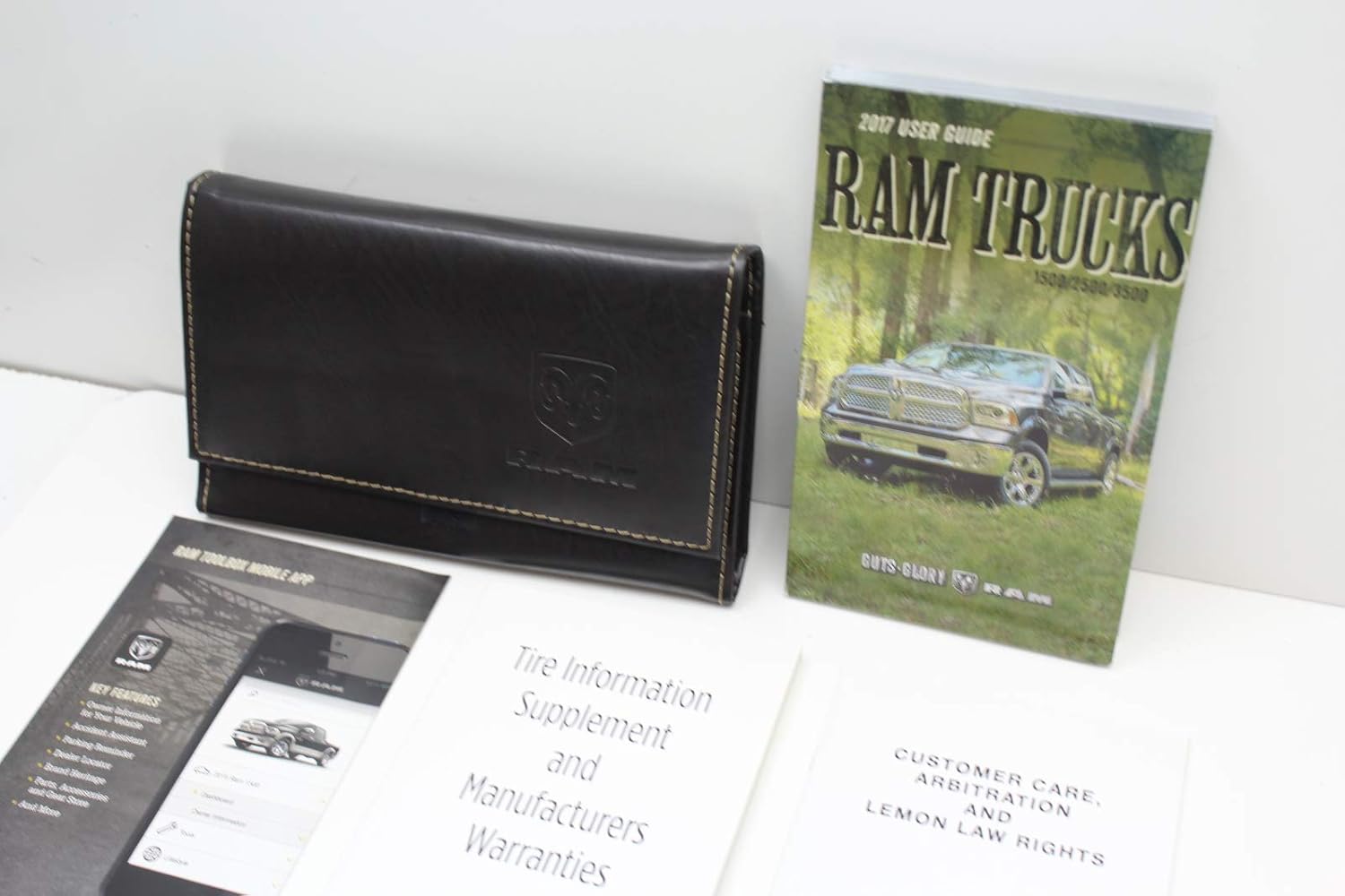 Close-up of the 2017 Dodge Ram owner's manual and leather case