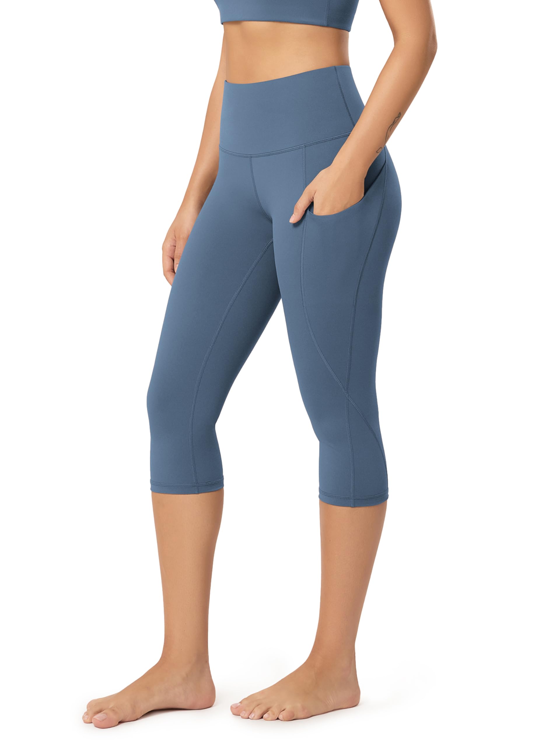 ODODOS Women's High Waisted Yoga Capris with Pockets, Tummy Control Non See Through Workout Athletic Running Capri Leggings
