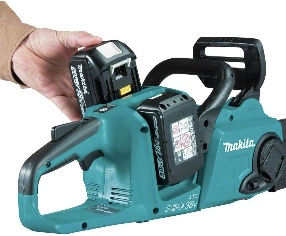 Installing batteries into Makita XCU04PT chainsaw