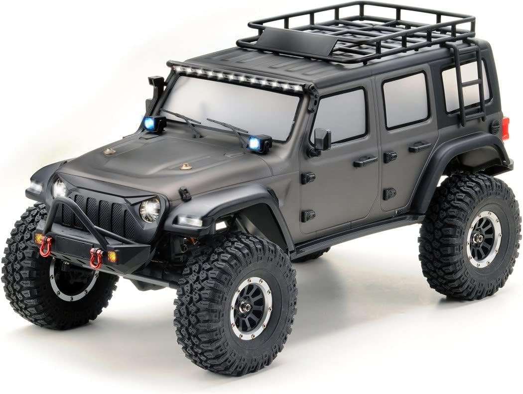Absima 12011 DIY Car, a 1:10 scale 4WD RC Crawler, shown from a front-side angle, highlighting its robust tires, front bumper, and roof rack.