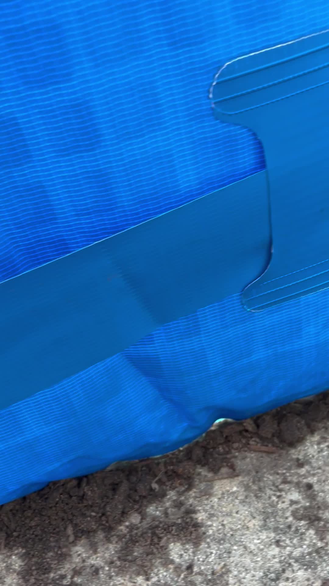 Intex customer service contact information displayed on the side of a pool liner, advising not to return the product to the store.