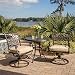 Hanover TRADITIONS3PCSW Traditions 3-Piece Aluminum Rust-Free Outdoor Patio Bistro Set with 2 Swivel Rocker Chairs, Tan Cushions and Cast-Top Round Table