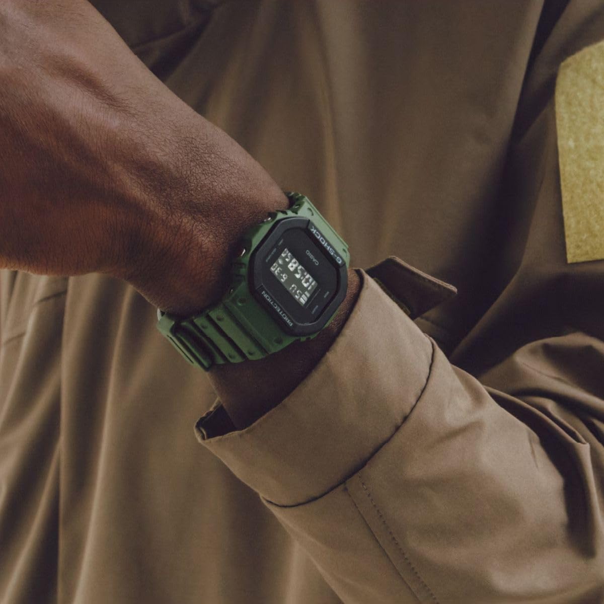 Casio G-Shock DW5610UU-3 watch worn on a wrist, demonstrating its fit and style.