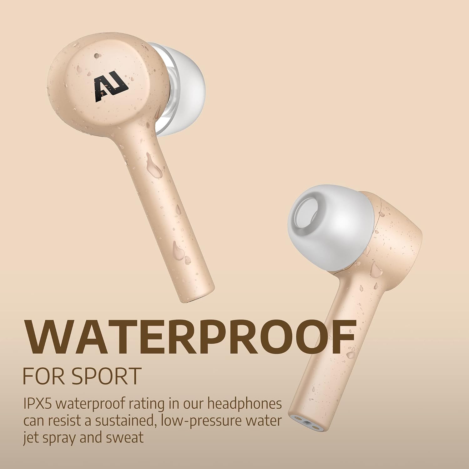 Gold Ausounds AU-Stream earbuds with water droplets, indicating water resistance.