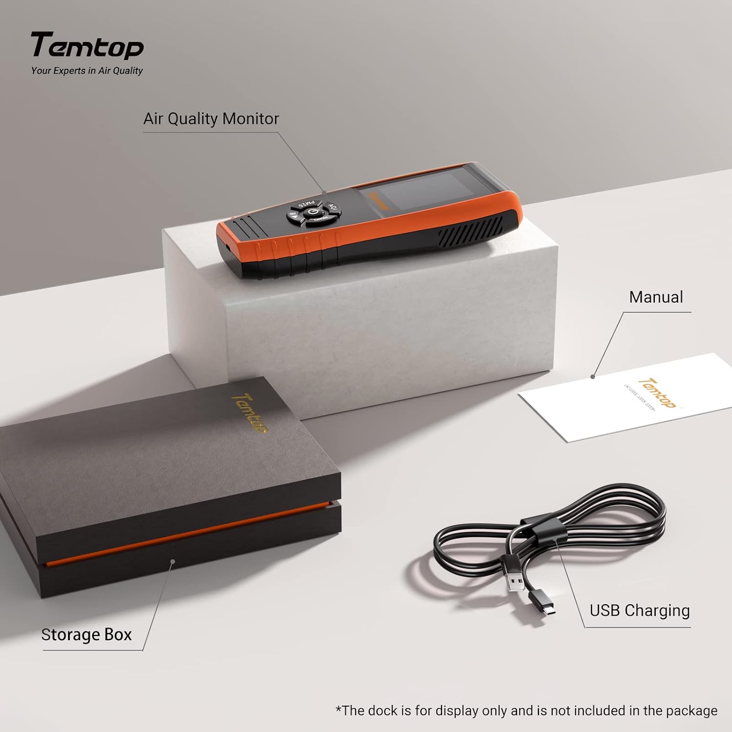 Contents of the Temtop LKC-1000S+ package including the monitor, storage box, manual, and USB charging cable.