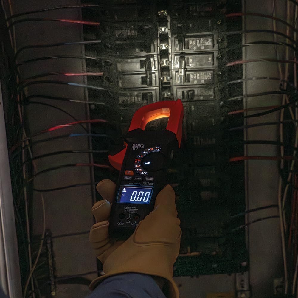 Electrician uses Klein CL810 clamp meter in electrical panel.