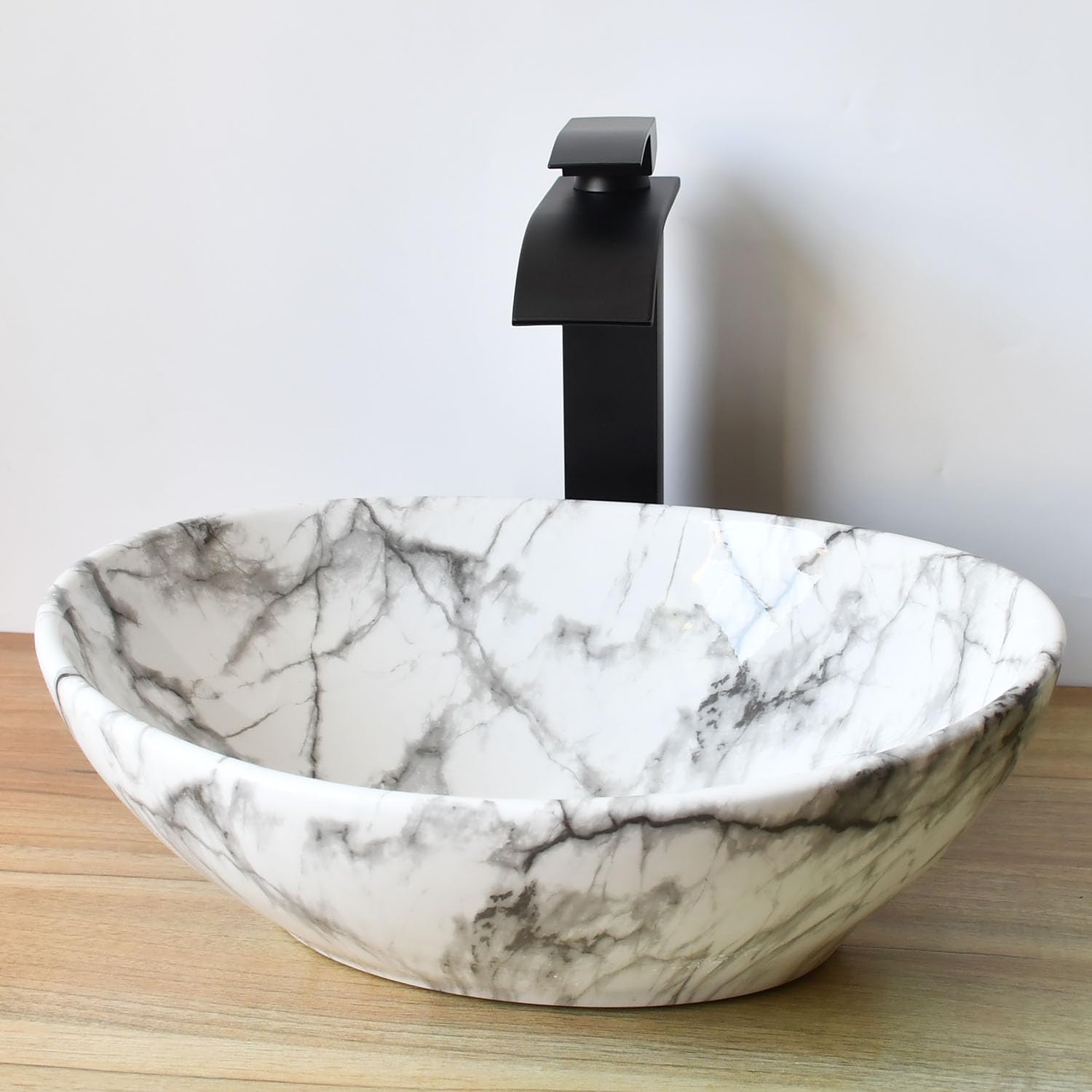 Bathroom Sink Oval White Vessel Sink with Waterfall Faucet and Drain Combo 16 Inch Marbling Ceramic Vessel Sink for Above Counter Artistic Bowl Sink