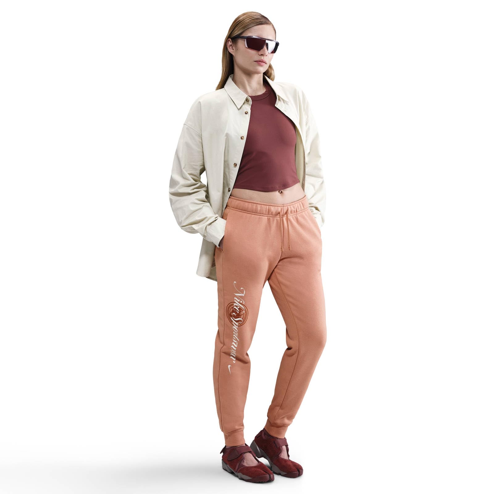 NIKE Nike Sportswear Club Fleece Hose Mit Mittelhohem Bund Und Grafik Für Damen - Spodnie Kobiety