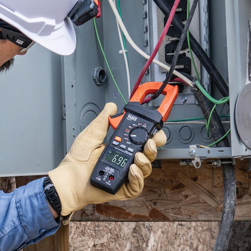 Electrician Uses Clamp Meter on Wiring