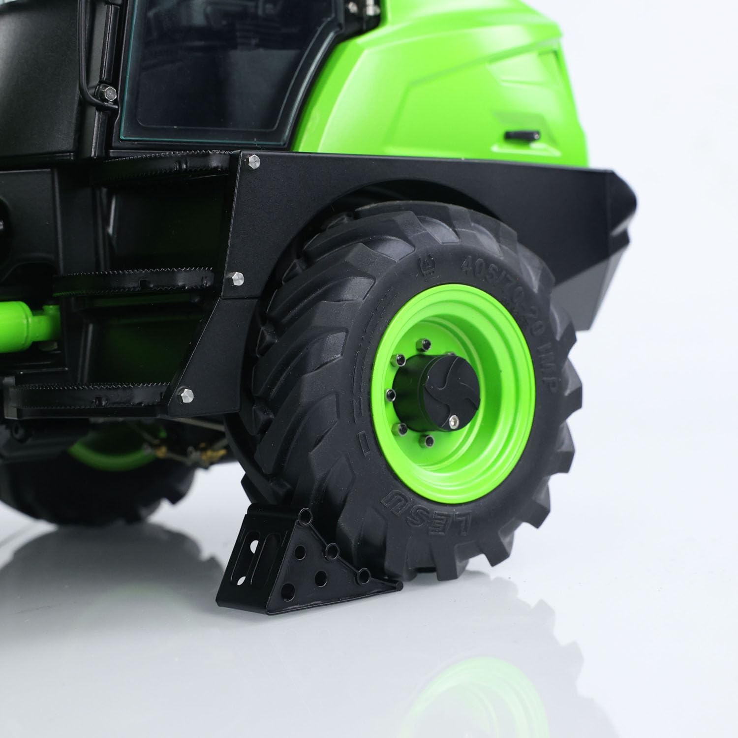 Close-up of the LESU AT1050 RC loader's fork attachment