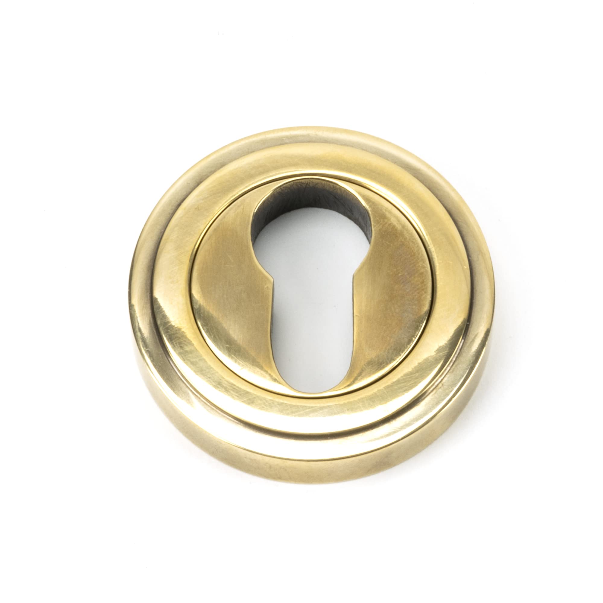 From The Anvil Aged Brass Round Euro Escutcheon (Art Deco) from B&Q