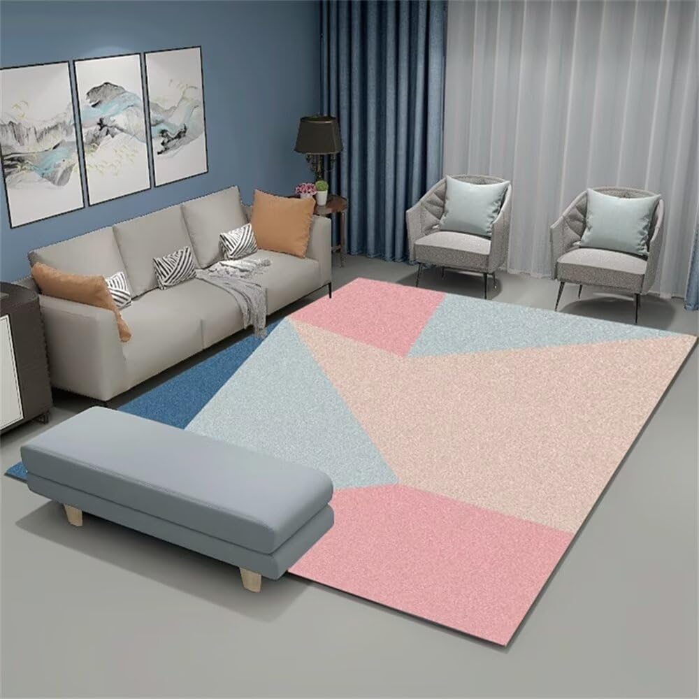 Deco chambre bébé tapis géométrique rose bleu pour créer un coin jeu dans le salon
