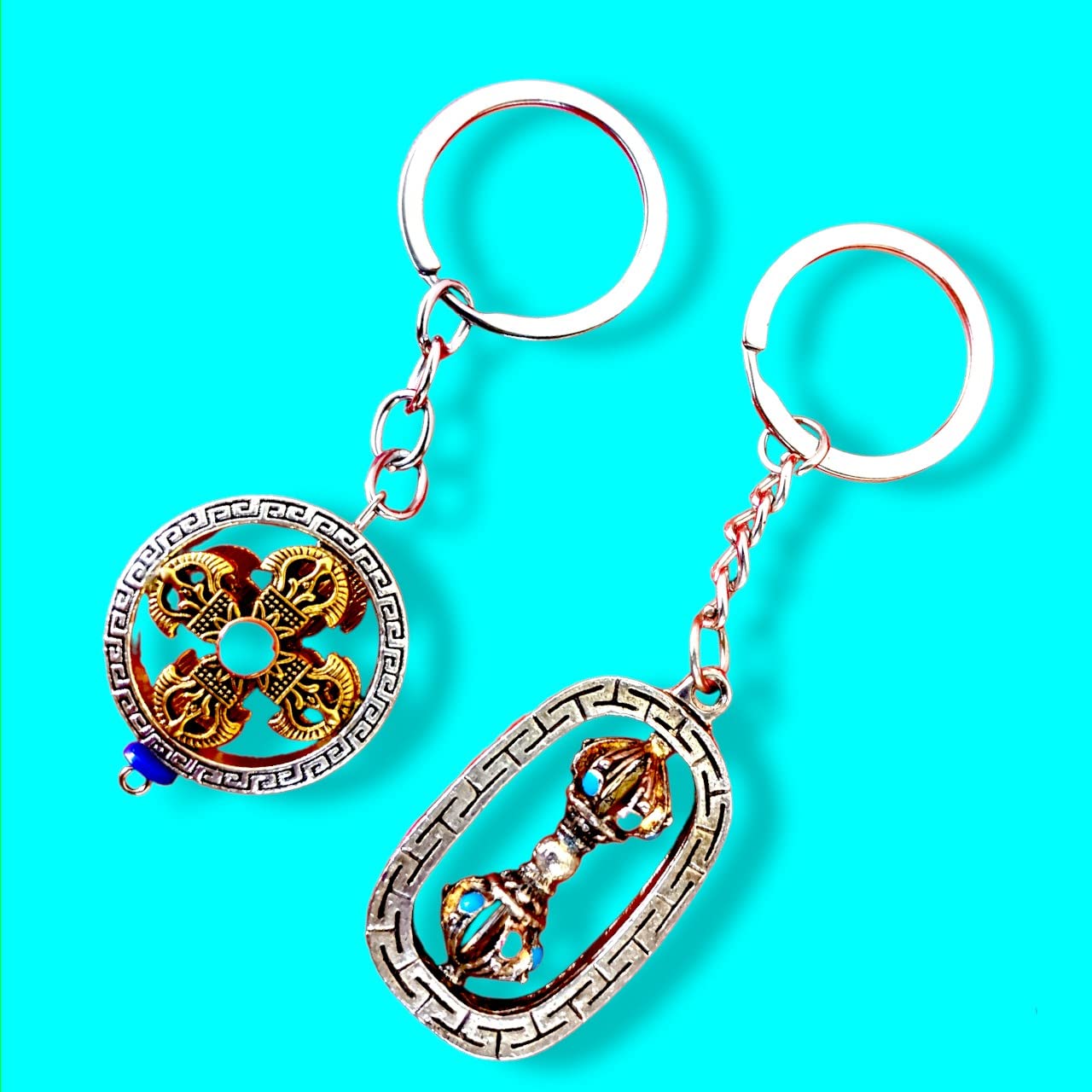 Buddhist Lucky sign keychain pack of 2 | Auspicious dorjee prayer keychain for bike car keys | uddhist Om Mani Padme Hum Engraved Hand Held Rotating Prayer Wheel in Golden Key Chain