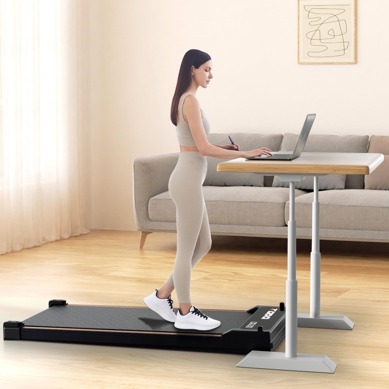A woman using the TODO Walking Pad Treadmill under a standing desk in a home office setting.