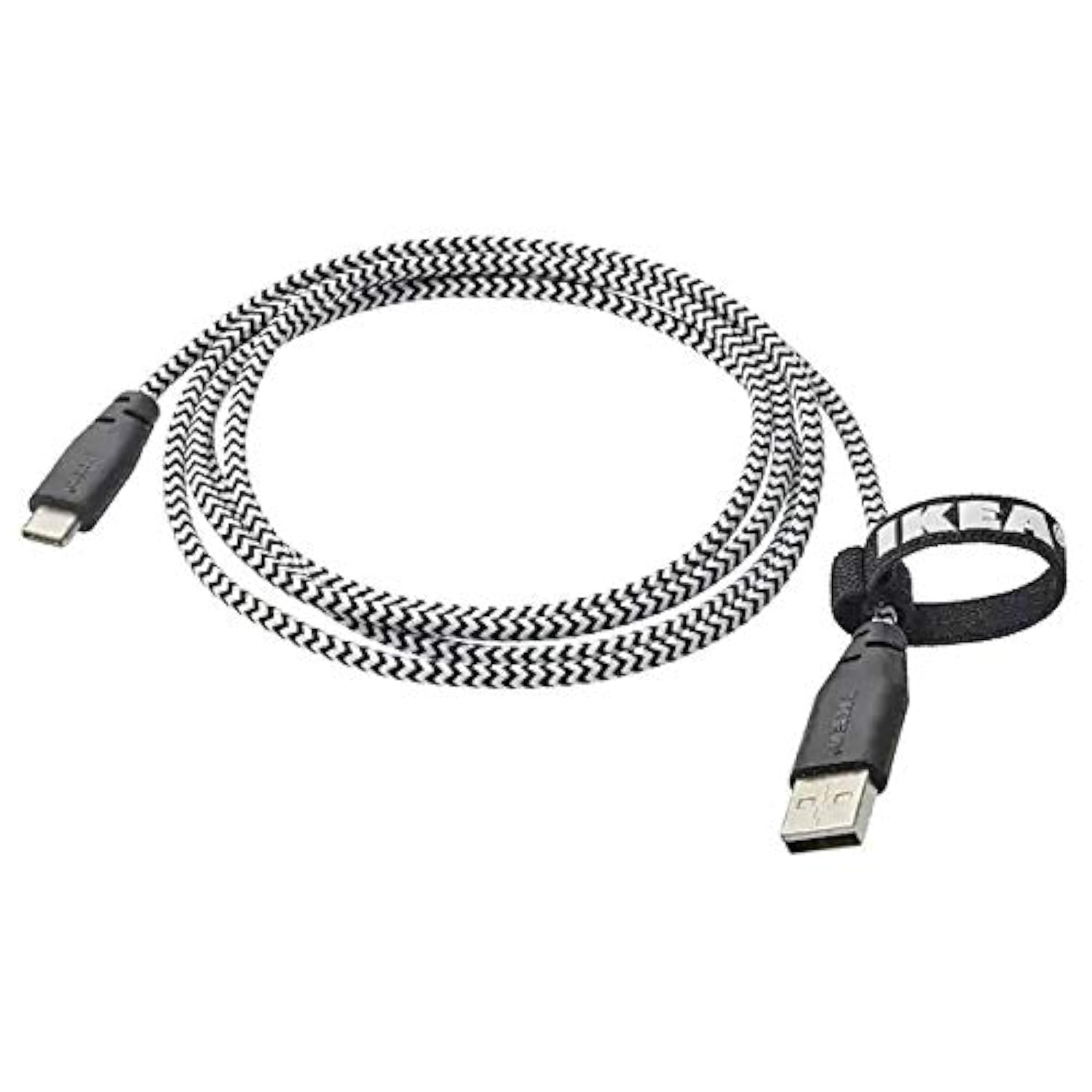 Ikea LILLHULT cable connected to a smartphone and charging base next to a laptop