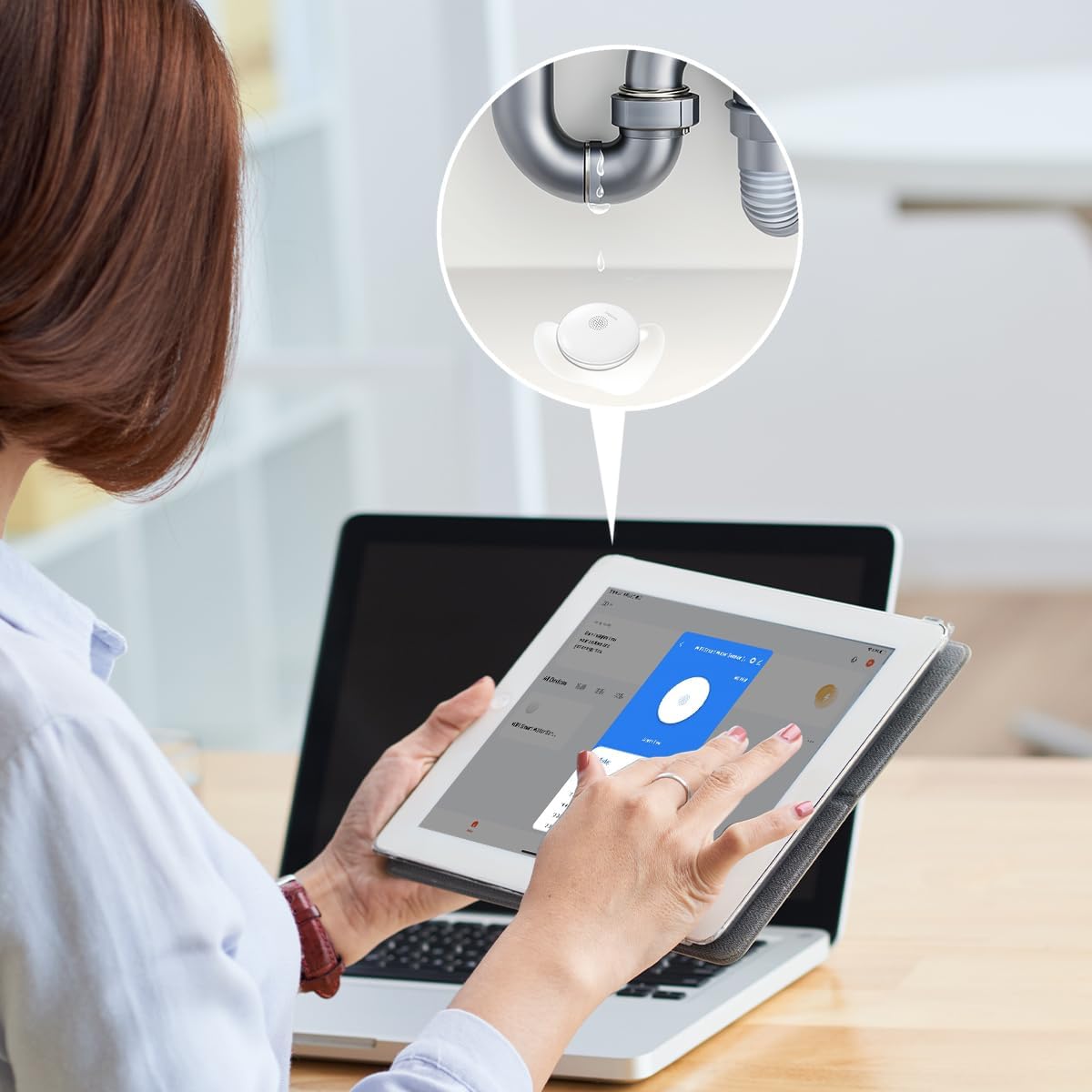 A person holding a tablet showing the Smart Life app with a notification bubble indicating a water leak detected by the LogiLink SH0134 sensor.