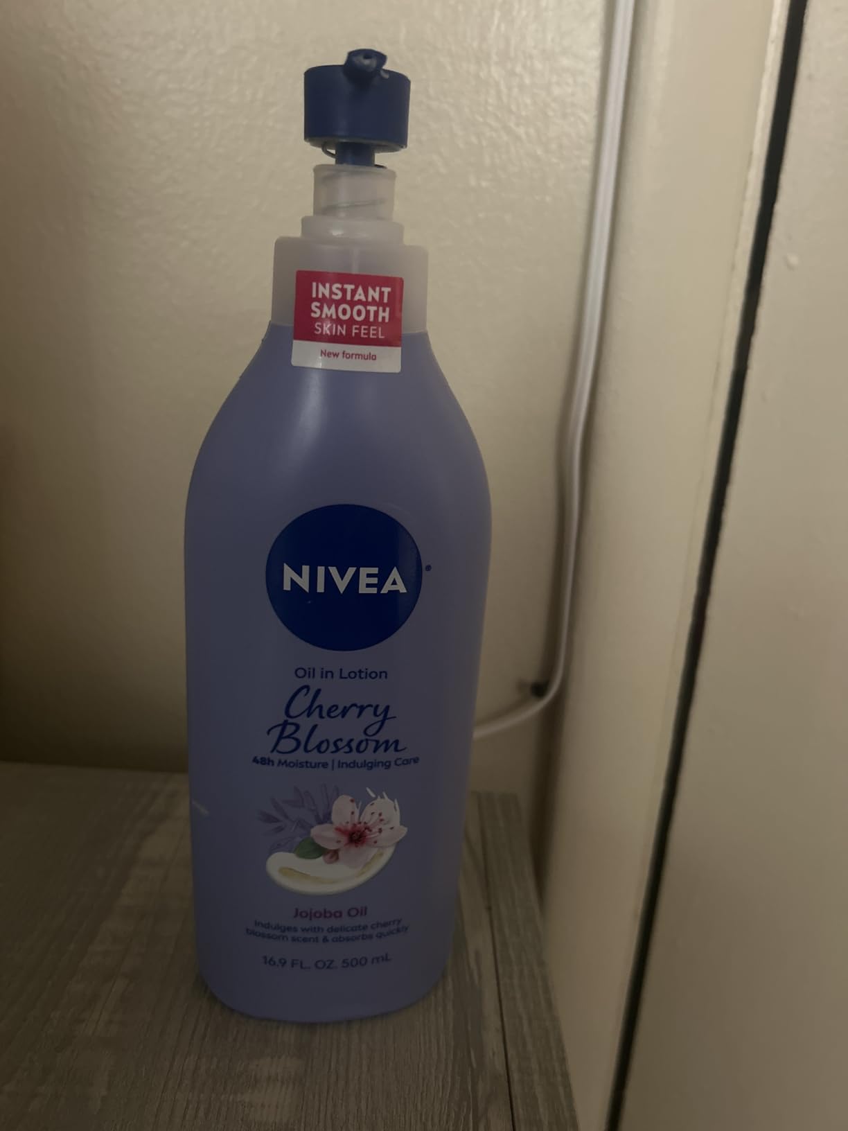 NIVEA Oil Infused Cherry Blossom and Jojoba Oil Body Lotion for Women, 16.9 Fl Oz Pump Bottle