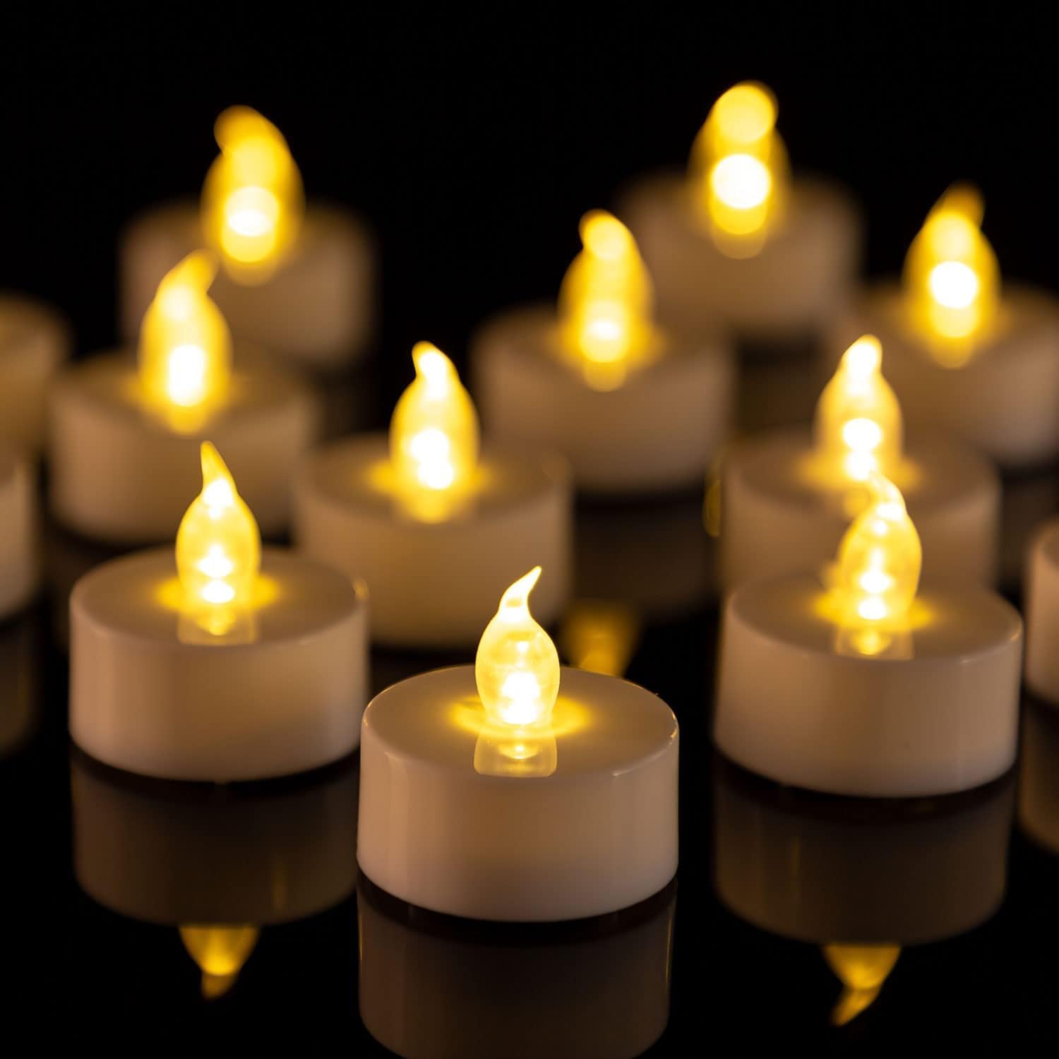 PUNPUBA Lot de 12 bougies chauffe-plat LED sans flamme à piles réalistes et lumineuses - Cadeau de vacances longue durée de 200 heures pour les fêtes et les fêtes - Jaune chaud
