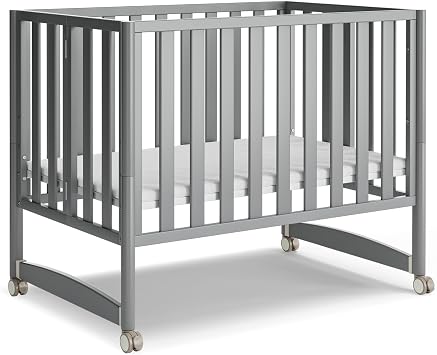 MAMAZING EvoNook 6-in-1 Convertible Mini Crib, 100% New Zealand Wood, Portable Mini Cribs with Wheels for Small Spaces, GREENGUARD Gold Certified, Grey