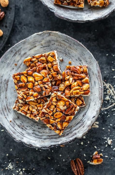 Image of Season Edition DryFruit Chikki with Saffron- 150g | Healthy Nutritious Delicious Crunchy Gajak Mithai with Goodness of Kaju Badam Pista Chikki Bar | Sweets Mixed Nuts Gift Pack | No Artificial Colors or Preservatives