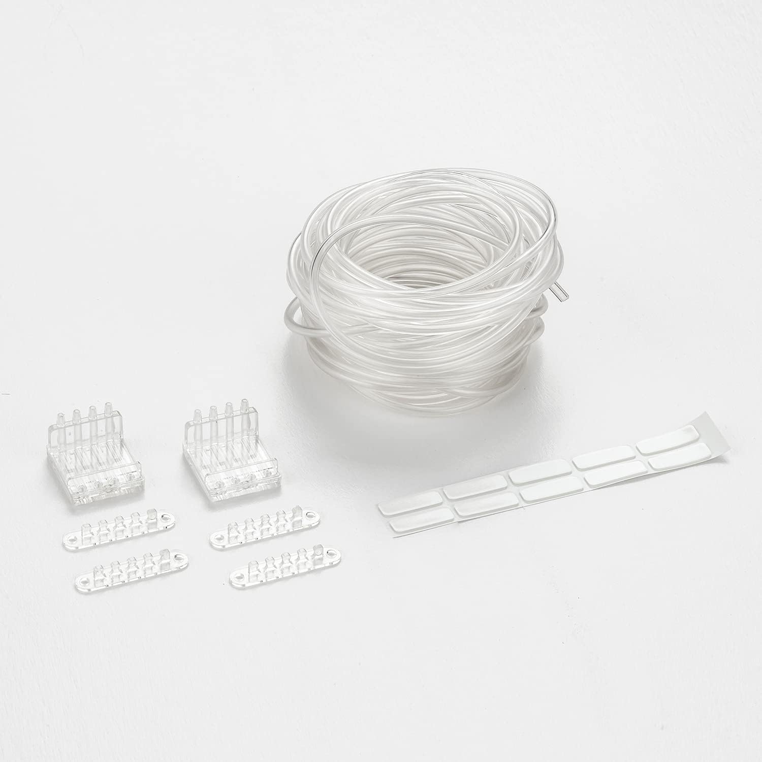 Small accessories including tube holders and adhesive labels