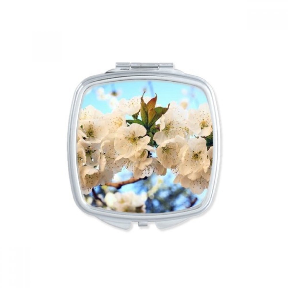 Miroir de poche fleurs blanches chic et compact pour retouches express