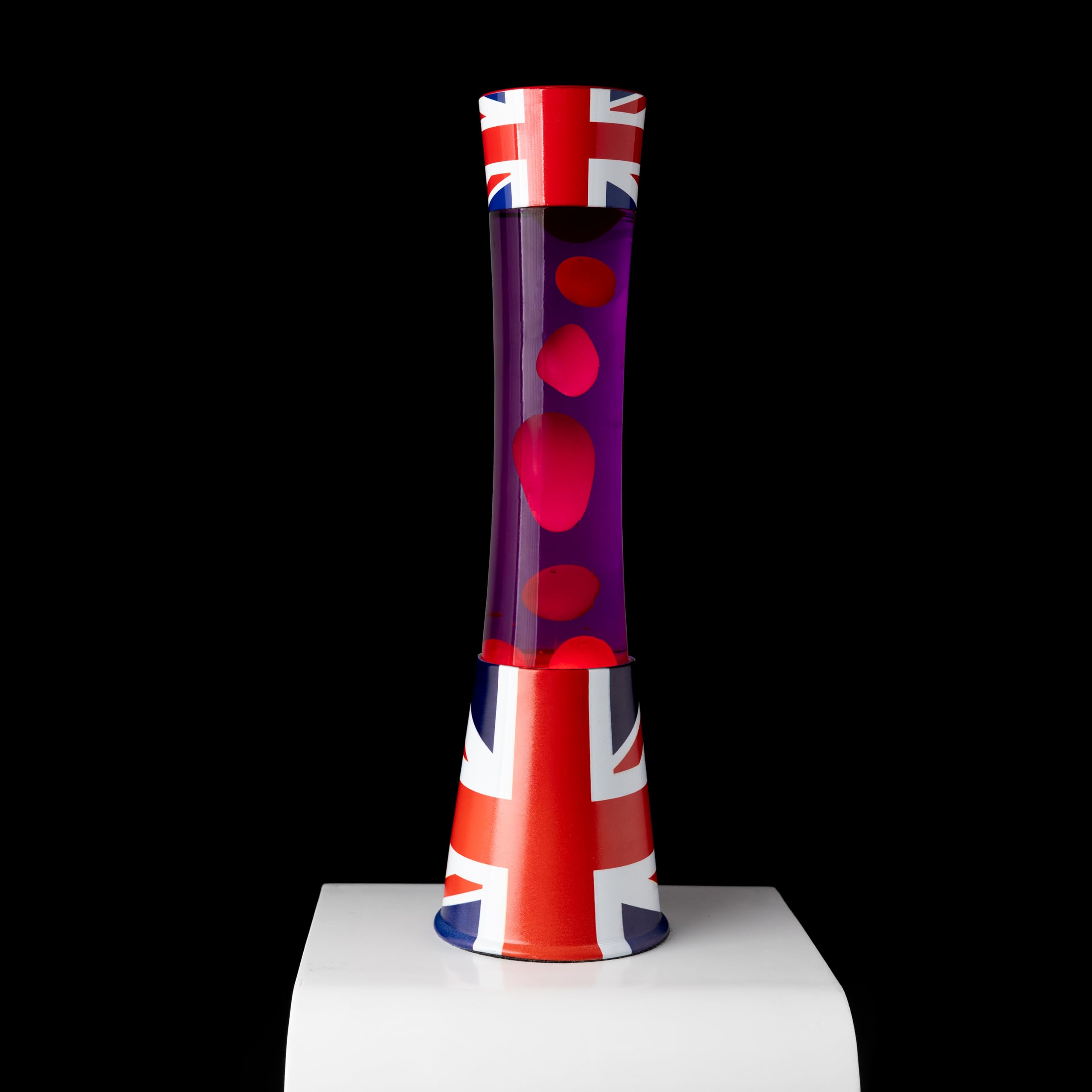 Fisura - Lámpara de lava bandera Reino Unido. Base con patrón de bandera, líquido morado y lava roja. Lámpara de efecto relajante. Con bombilla de repuesto. 11 cm x 11 cm x 39,5 cm.